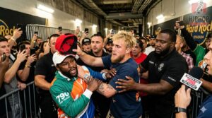 Jake Paul gotcha hat, Jake Paul Mayweather incident, gotcha hat prank, Floyd Mayweather Jake Paul fight promo, viral marketing stunt, influencer marketing strategy, Jake Paul money strategy, boxing promotion drama, Logan Paul Mayweather event, viral moments in sports